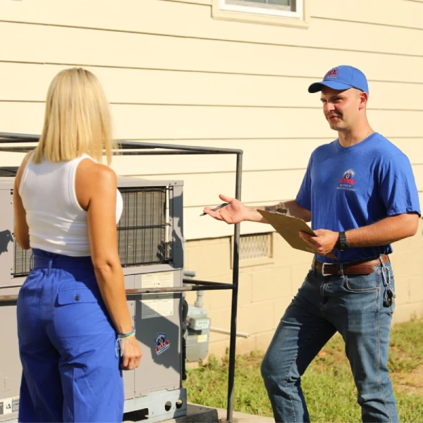 Man talking to woman about HVAC services in Cary NC